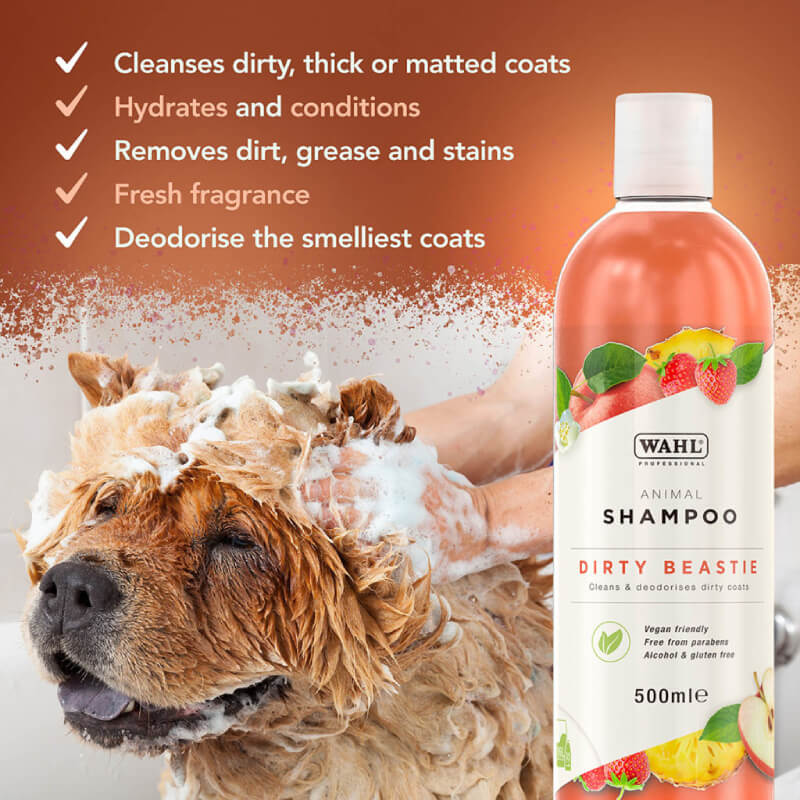 A dog is bathed with Wahl Dirty Beastie Shampoo; the bottle is shown next to the pet.