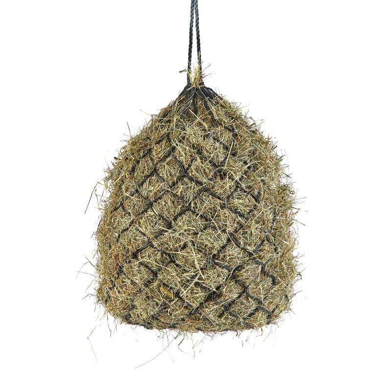 The Shires Haylage Net hangs by a black rope, filled with hay, against a white background.