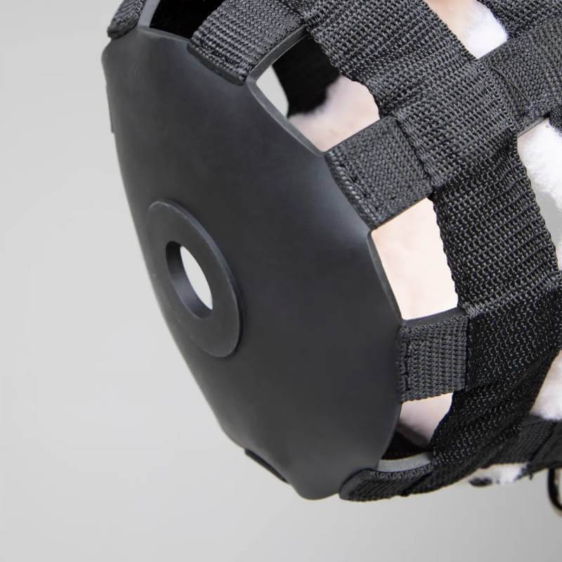 Close-up of the Shires FreeGraze Deluxe Comfort Grazing Muzzle, black with a round center hole.