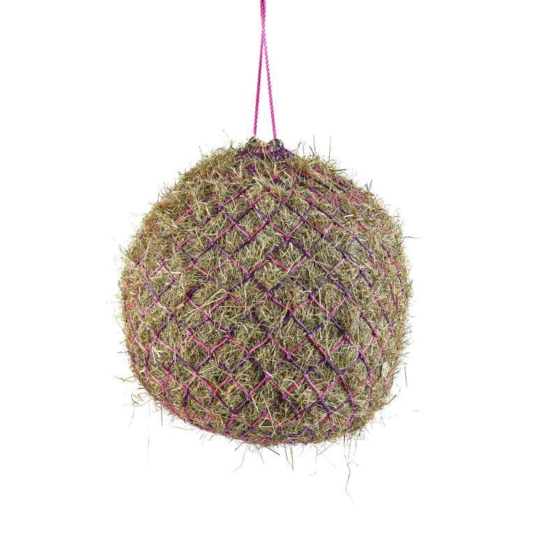 A Shires Deluxe Haynet filled with hay, in pink netting and hanging by a pink string.