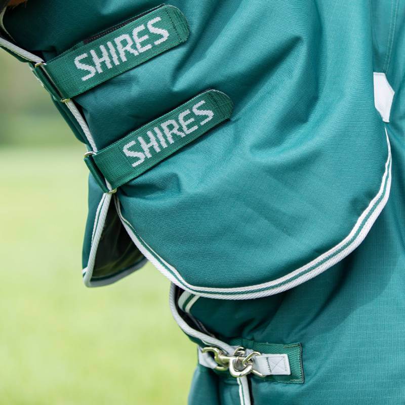 Close-up of Shires Highlander 300g green rug with SHIRES on its two Velcro straps.