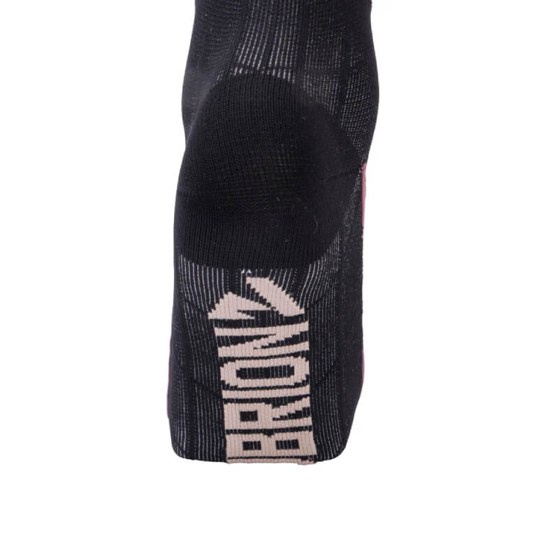 Mauve technical sock by Aubrion, shown from the bottom with "Aubrion" in white on the sole.