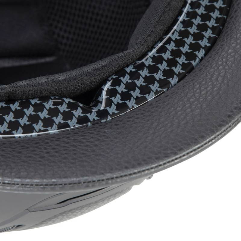 Close-up of Shires Karben Amity LTHR Riding Hat Black with patterned lining and textured edge.