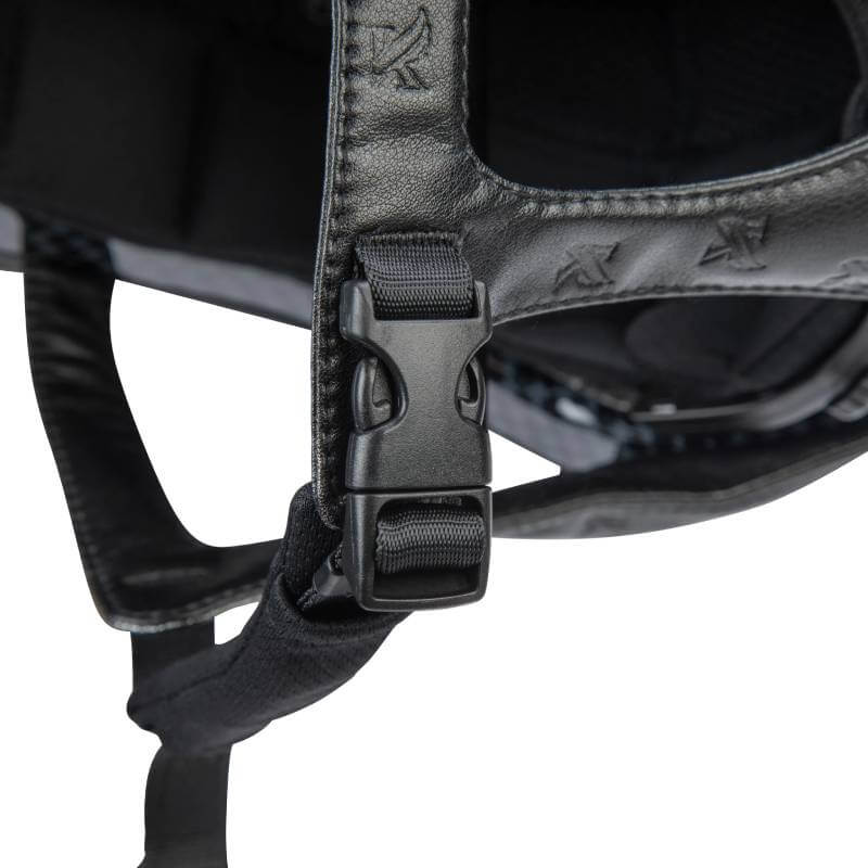 Close-up of Shires Karben Amity SPKL Riding Hat Black buckle on black leather strap.