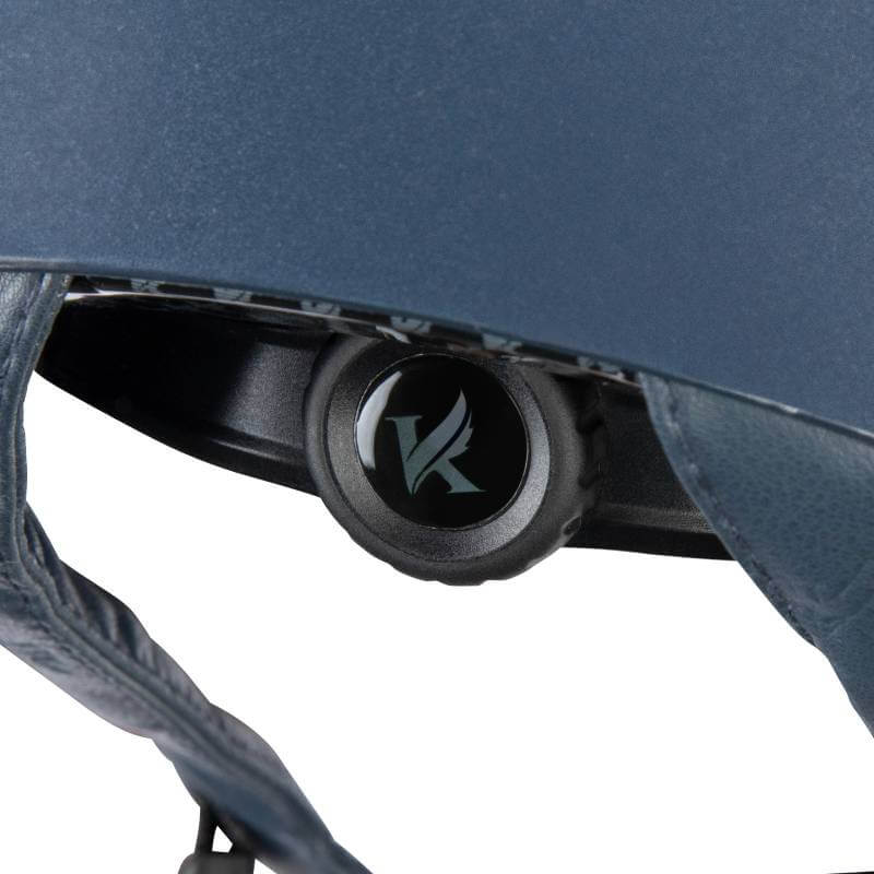 Close-up of Shires Karben Amity SPKL Riding Hat Navy adjustment dial with a bird logo.