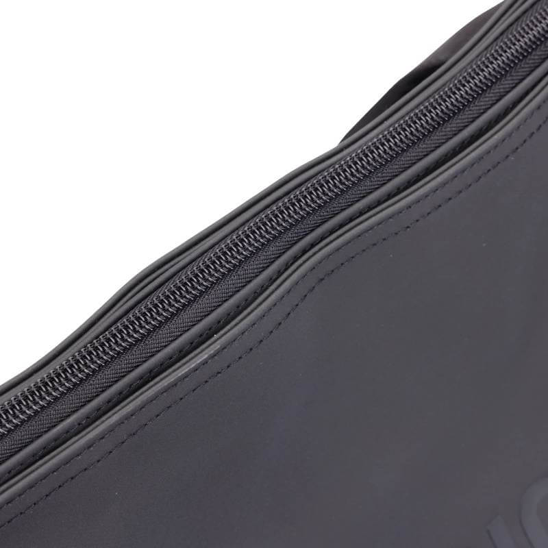 Close-up of the Aubrion React Tote Bag Black's zipper on dark gray fabric by Aubrion.