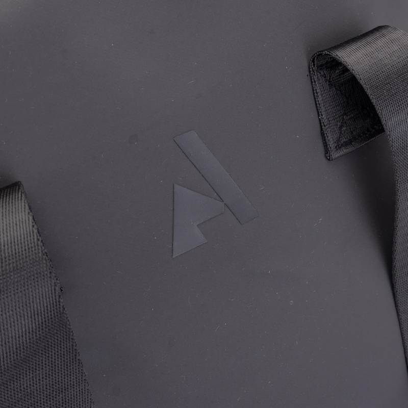 Close-up of the Aubrion React Hat Bag Black with stylized A logo and two straps for protection.