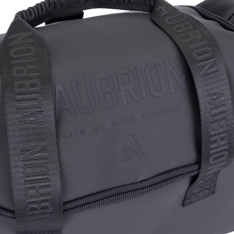 Close-up of the Aubrion React Grooming Kit Bag Black with embossed logo and branded straps.