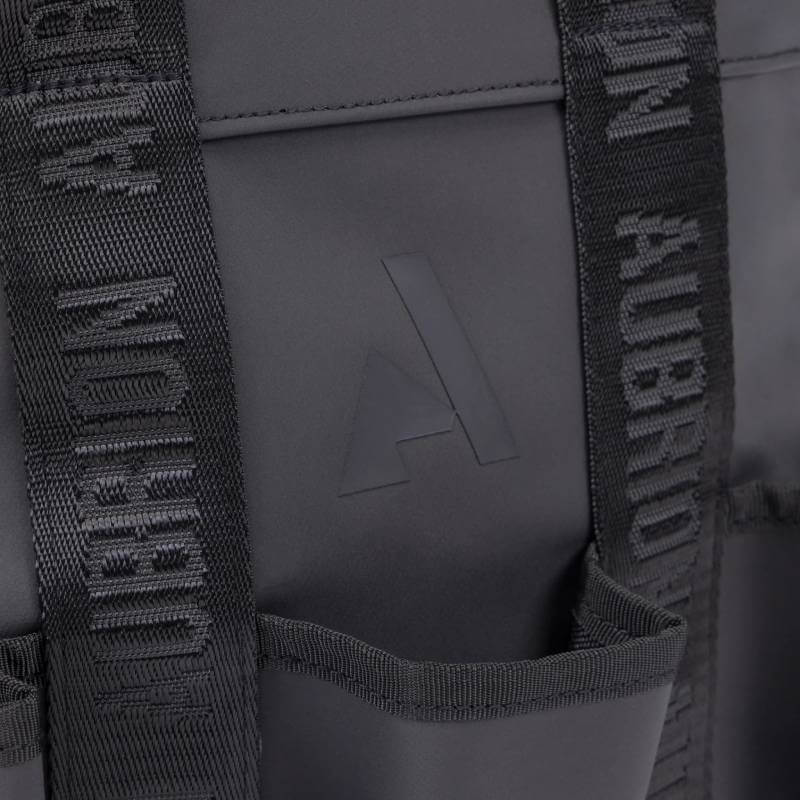 Close-up of Aubrion React Large Grooming Kit Bag Black with embossed logo and branded straps.