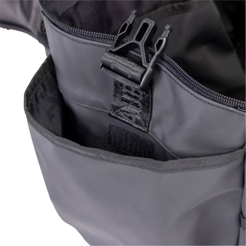 Close-up of Aubrion React Large Grooming Kit Bag Black with zipper, buckle, and open front pocket.