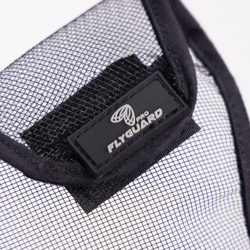 Close-up of Shires FlyGuard Pro Grackle Bridle Nose Net Black with logo tag attached.