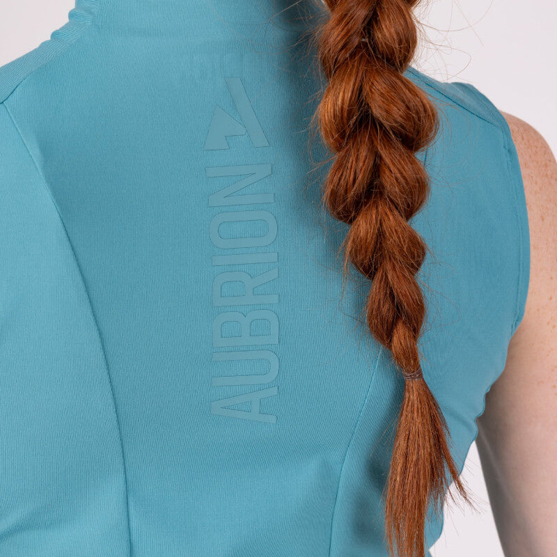 Close-up of a person in the Aubrion React Sleeveless Baselayer Haze, perfect for warm weather.