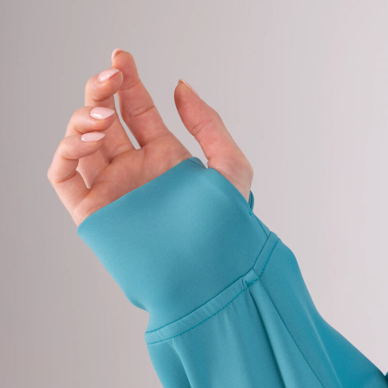 Hand in Aubrion React Quarter Zip Hoodie Haze, teal stretch scuba, thumb hole, curled fingers.