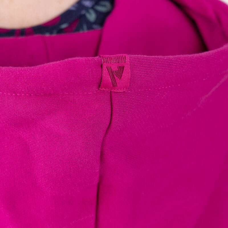 Close-up of Aubrion React Hoodie Fuchsia with folded seam and stylized A tag.