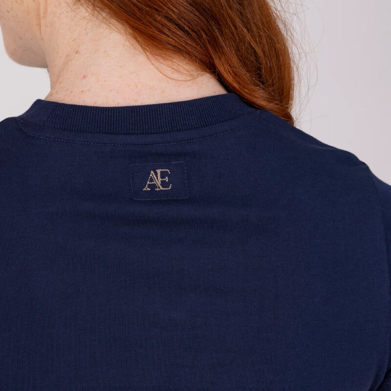 Person shown from back in navy Aubrion Equestrian T-Shirt Midnight, AE logo, reddish-brown hair.
