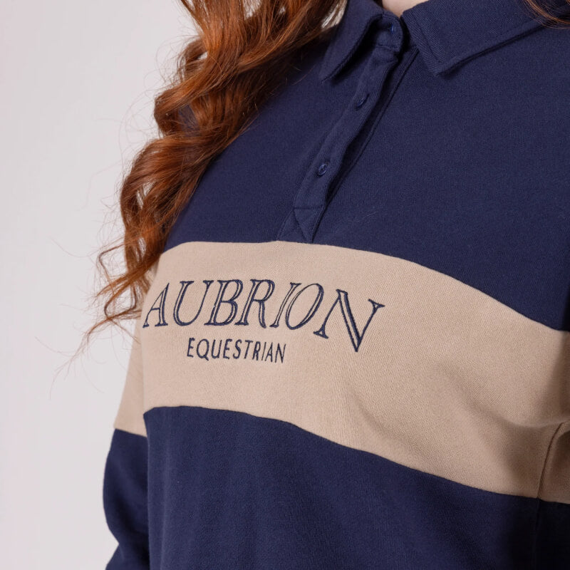 Close-up of a person in an Aubrion Equestrian Button Sweatshirt, Midnight/Taupe.