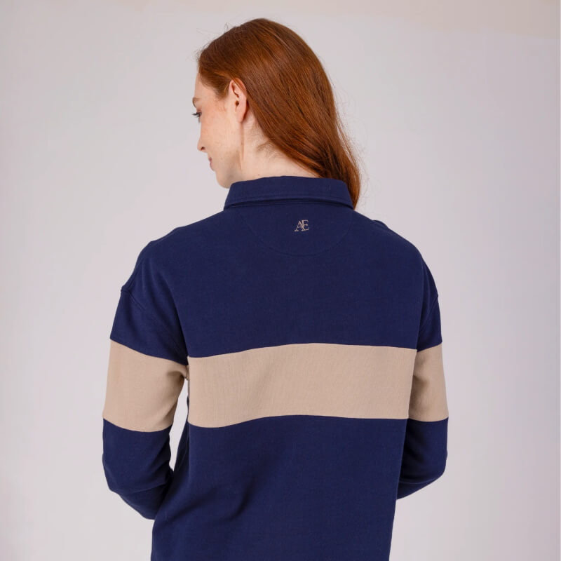 Long-haired model in Aubrion Equestrian Button Sweatshirt Midnight/Taupe, back to camera.