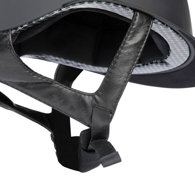 Close-up of the Shires Karben Amity SMRT Riding Hat Black showing chin straps and padding.