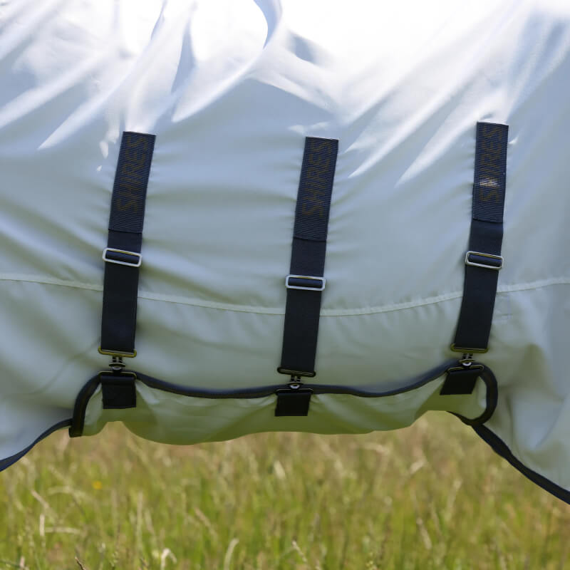 Shires Highlander Plus Sweet-Itch Combo Neck Fly Rug White/Air Force, shown on grass.