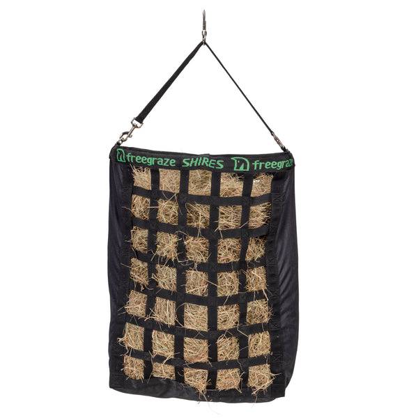 Shires Freegraze Deluxe Web Front Hay Bag—black, slow-feed, hangs via strap and clip.