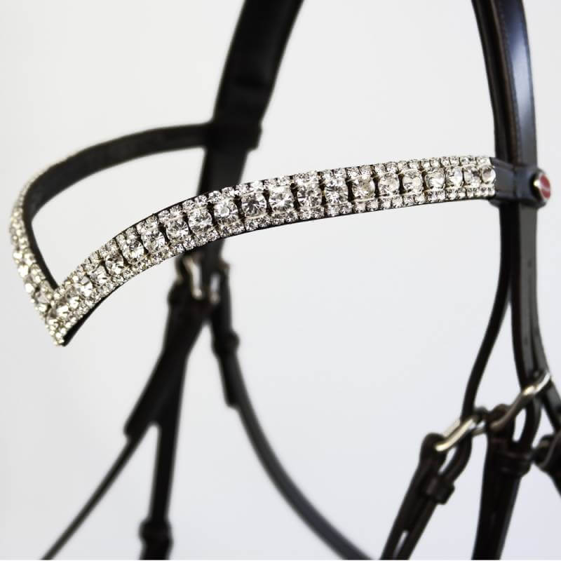 Close-up of the Whitaker John Whitaker Lynton Snaffle Bridle with V-shaped rhinestone browband.