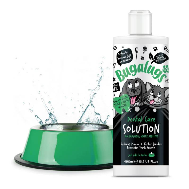 Bugalugs Dental Care Water Solution Additive for Dogs & Cats 490ml beside green pet water bowl.