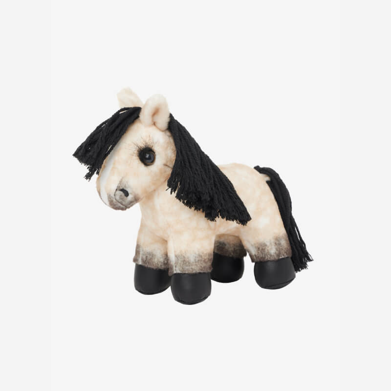 The LeMieux Tiny Pony Dream in blue stands outdoors on a cobblestone path.
