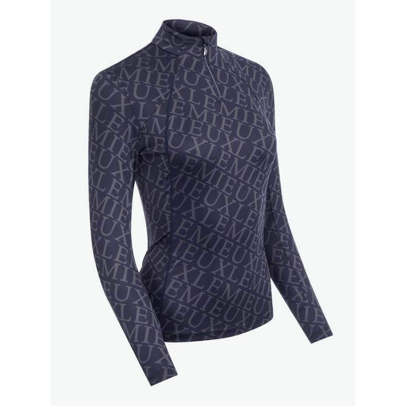 LeMieux Fleur Base Layer Navy: navy long-sleeve riding top with front zip and LUXE text pattern.