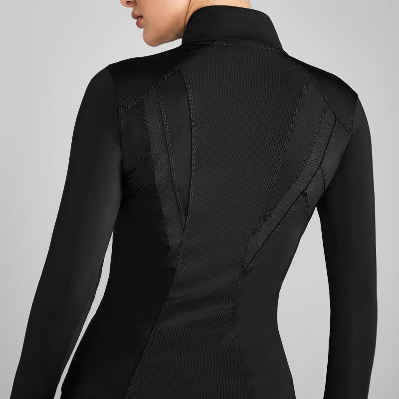 Woman in Aztec Diamond Core Fitted Jacket Black, back view, visible seam details.