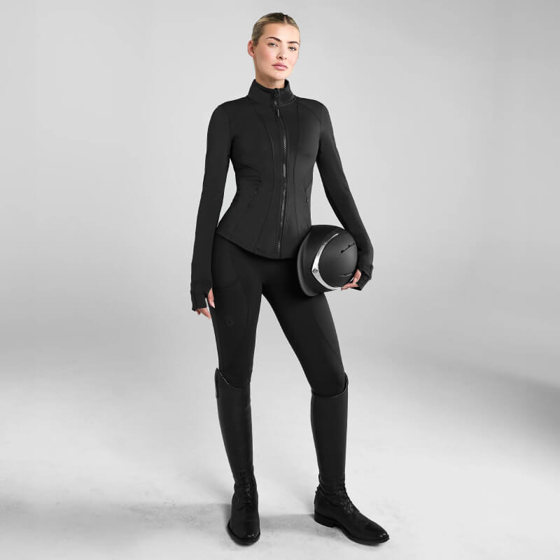 Model in Aztec Diamond Core Leggings Knee Grip Black and black jacket, shown waist to knees.