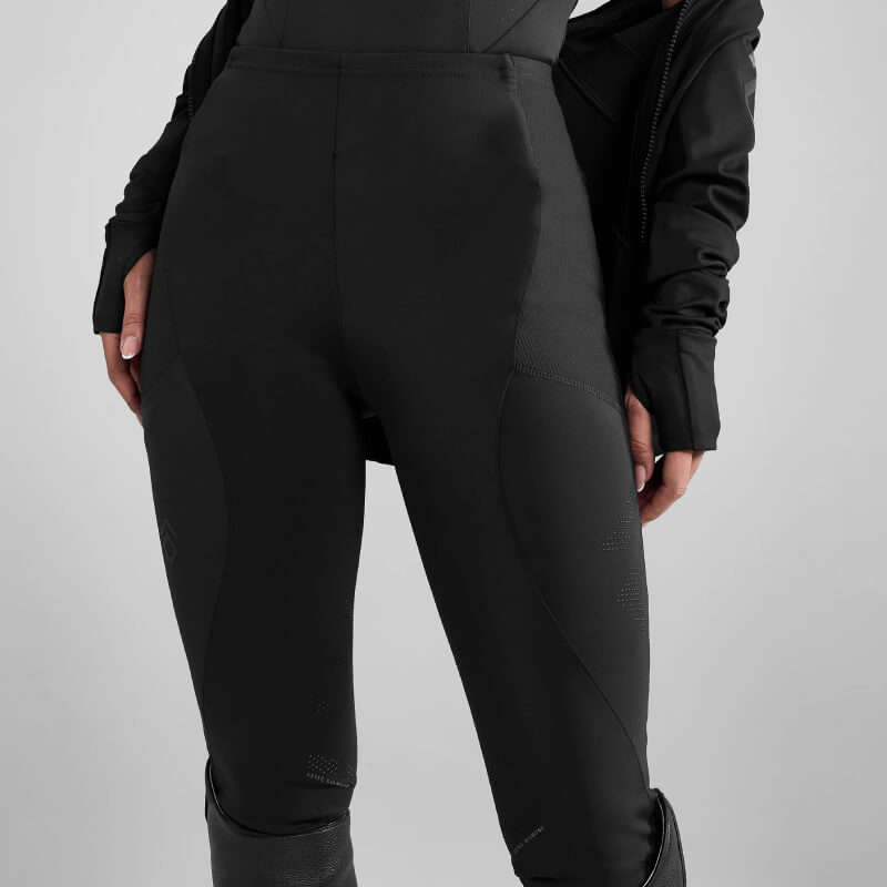 Model in Aztec Diamond Core Leggings Knee Grip Black and black jacket, shown waist to knees.