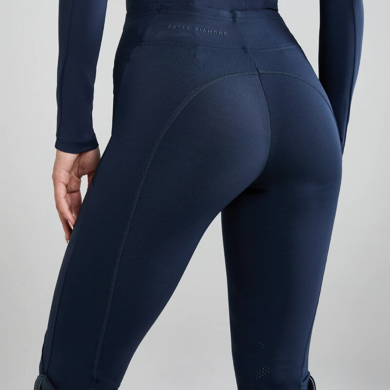 Person in Aztec Diamond Core Leggings Knee Grip Navy made from recycled sports fabric.