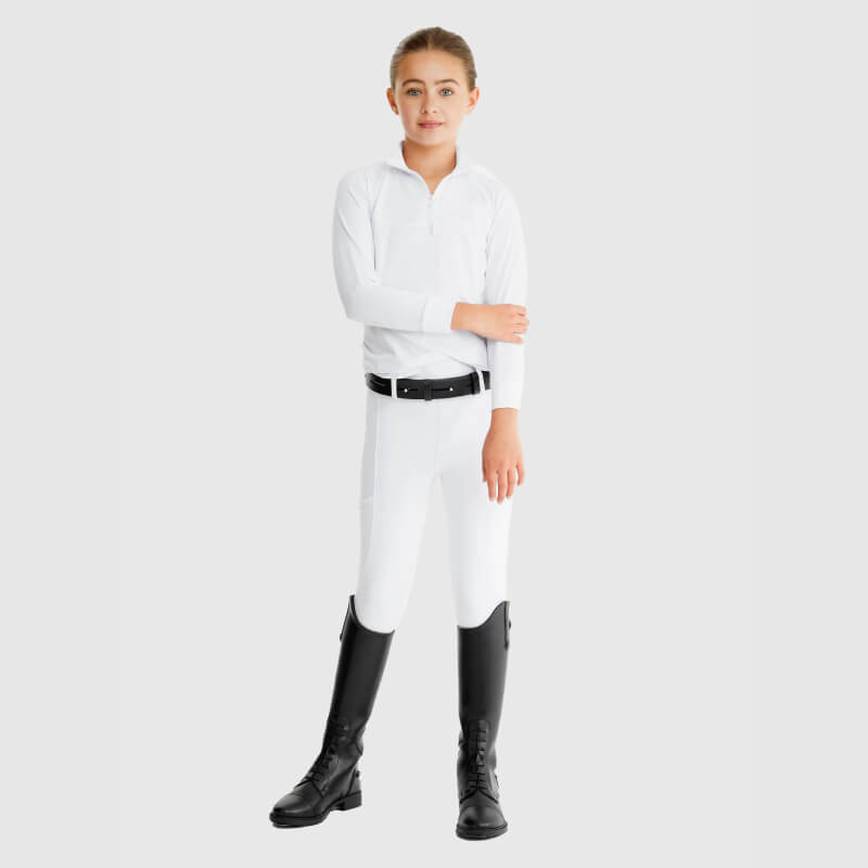 Confident girl in Aztec Diamond YR Mesh Shirt White stands arms crossed on plain background.