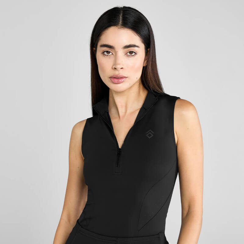 Woman in Aztec Diamond Core Sleeveless Baselayer Black stands against a plain light background.