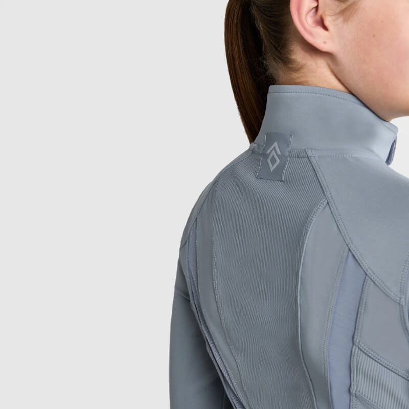 Individual in an Aztec Diamond YR Fitted Jacket Ash Blue with stitched details and small logo.