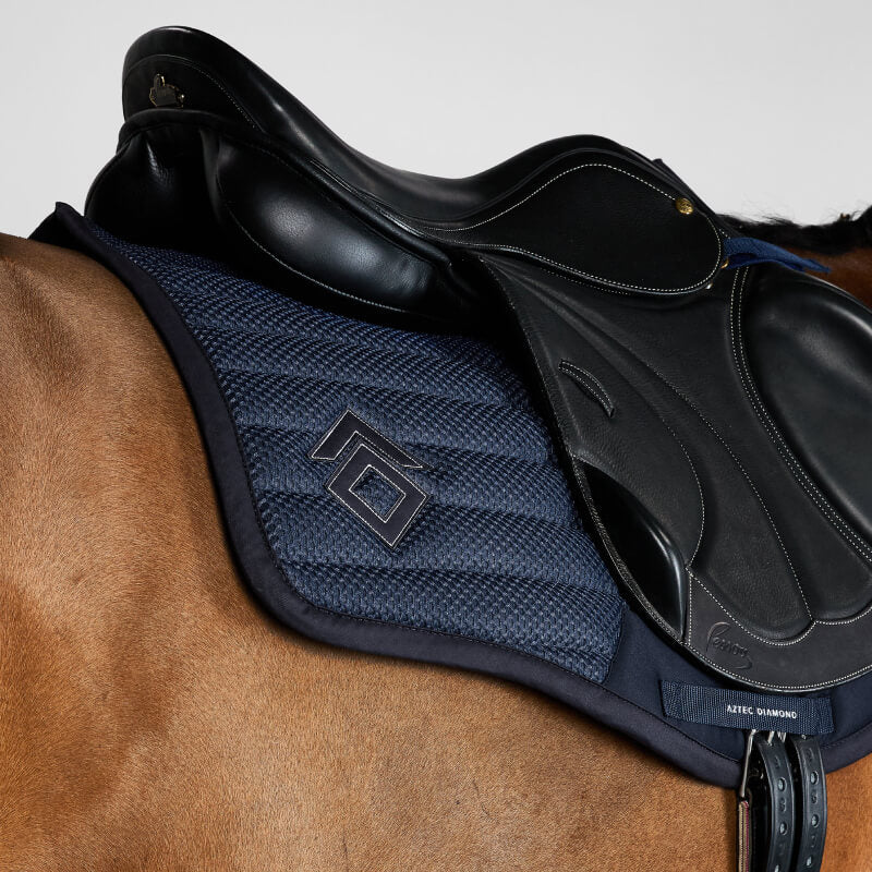 Aztec Diamond Mesh Saddle Cloth Jump Cut Navy on gray horse with jump saddle, white background.