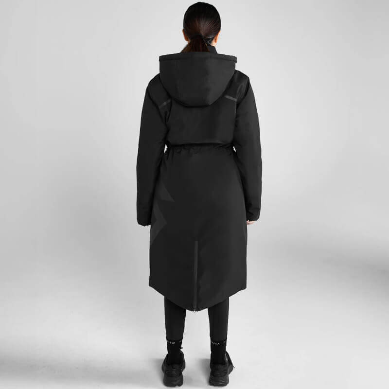 Person in Aztec Diamond Black Fleece Lined Rain Jacket faces away in a white studio.