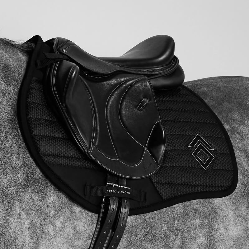 Aztec Diamond Mesh Saddle Cloth Jump Cut Black on horse’s back, side view.