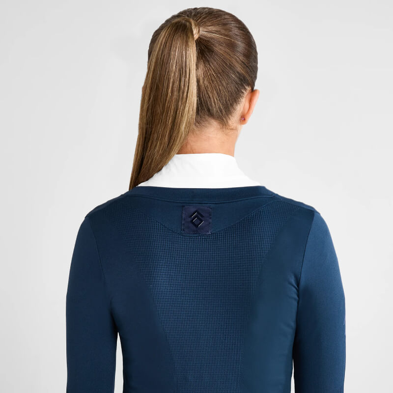 Woman with ponytail, back view, in Aztec Diamond YR Show Sweater Navy with white collar.