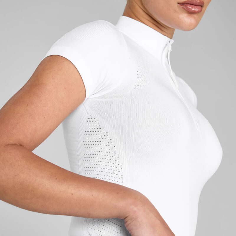 Woman wears Aztec Diamond 3D Woven Show Shirt White with short sleeves and zip-up collar.