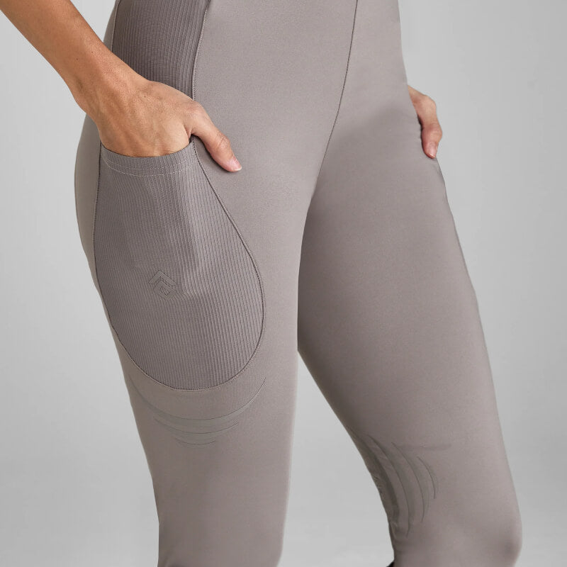 Model in Aztec Diamond Define Leggings Knee Grip Truffle and tall black riding boots, shoulders down.