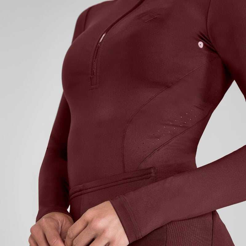 Person wearing a cherry Aztec Diamond Core Baselayer, shown from shoulders to waist.