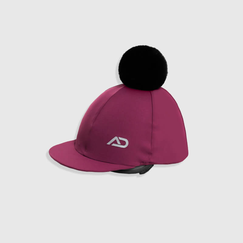 Aztec Diamond YR Pom Hat Silk Raspberry with black pom-pom and white AD logo.