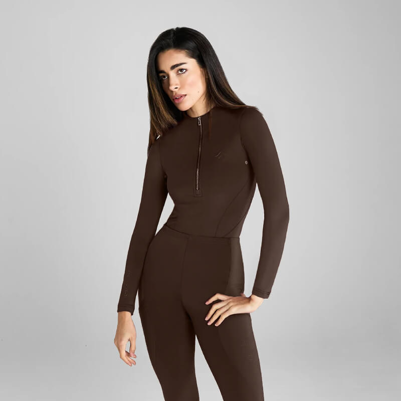 Person in Aztec Diamond Core Baselayer Mocha stands against a plain light gray background.