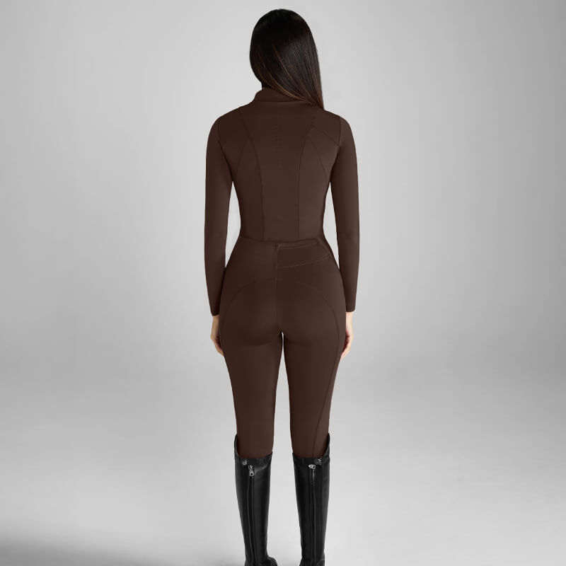 Woman in Aztec Diamond Core Leggings Knee Grip Mocha, standing with back to camera.