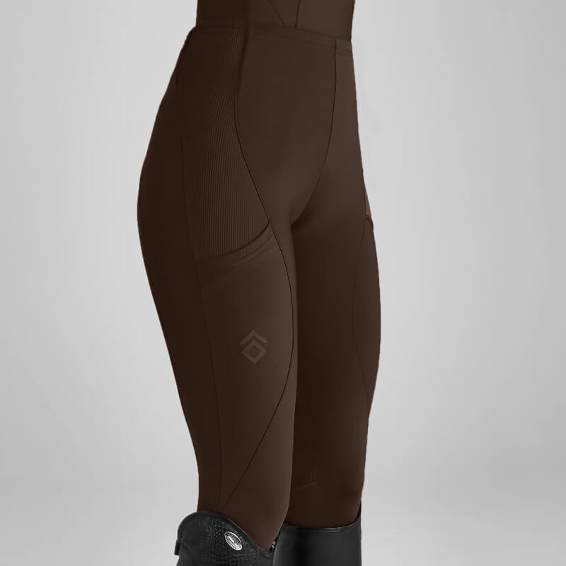Model in Aztec Diamond Core Leggings Knee Grip Mocha and tall black riding boots, waist to mid-calf.