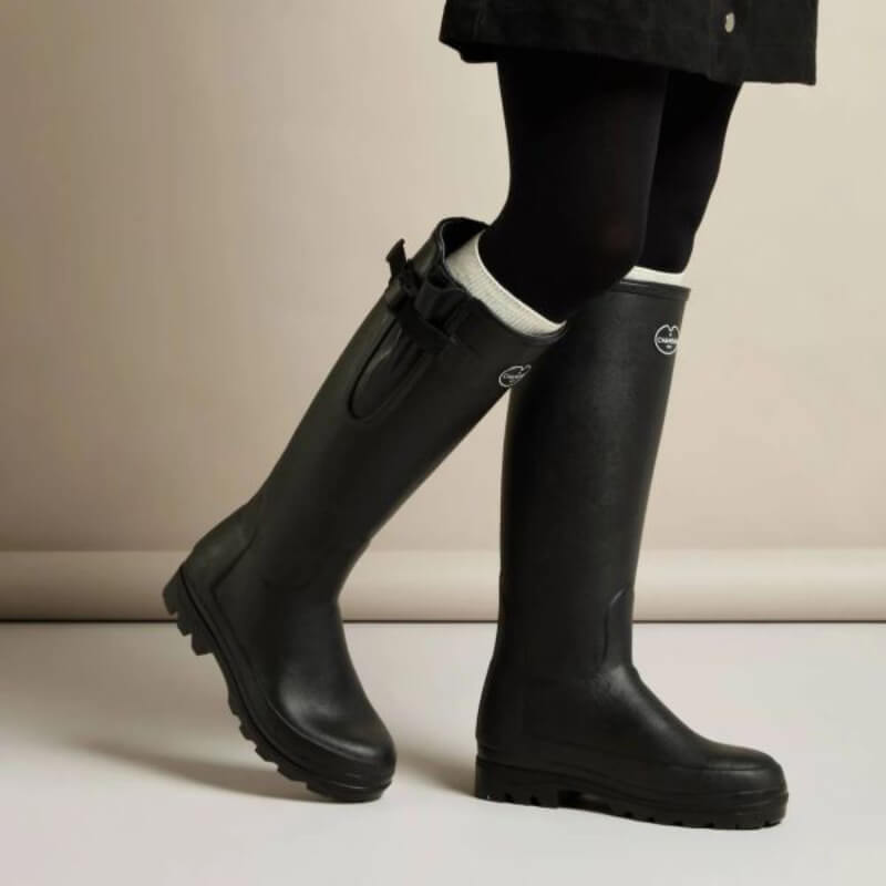 Wearing Le Chameau Vierzonord Noir boots, black leggings, and a dark coat.