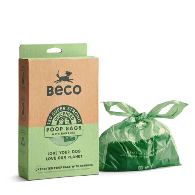 Beco Large Poop Bags with Handles Unscented box beside a tied green dog poop bag.
