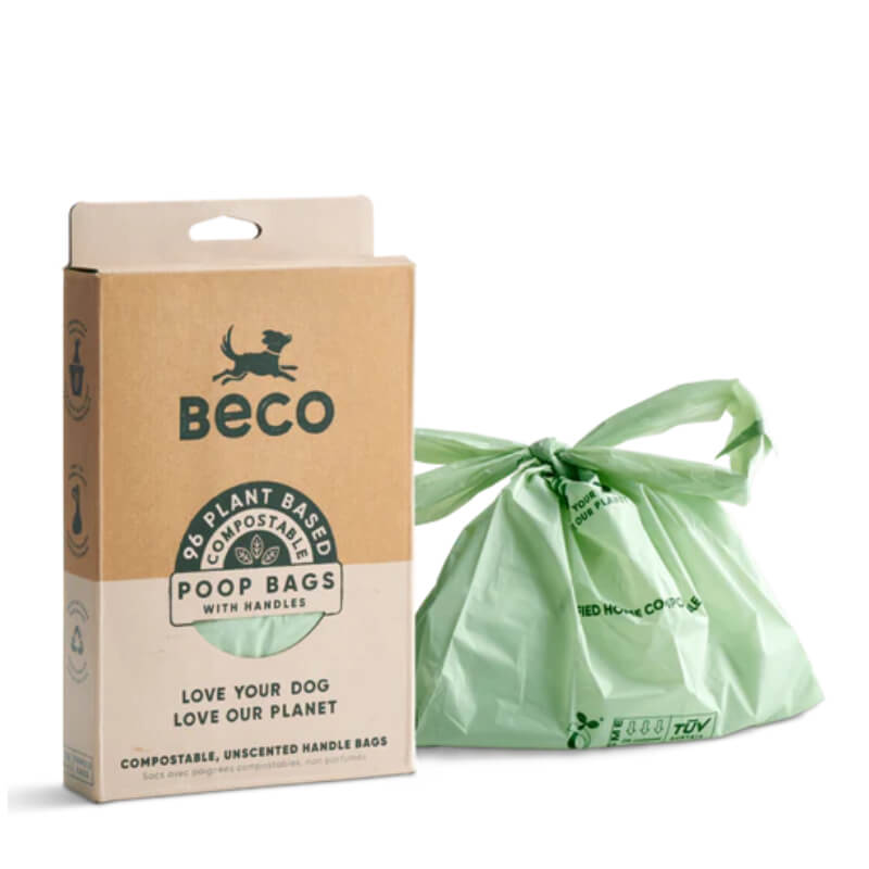 Beco Home Compostable Poop Bags with Handles 96pk shown next to a tied green waste bag.