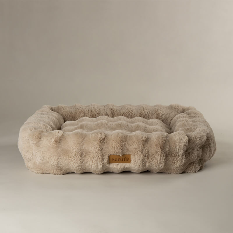 Rectangular Scruffs Alpine Box Bed in champagne with plush faux fur sides and front label.